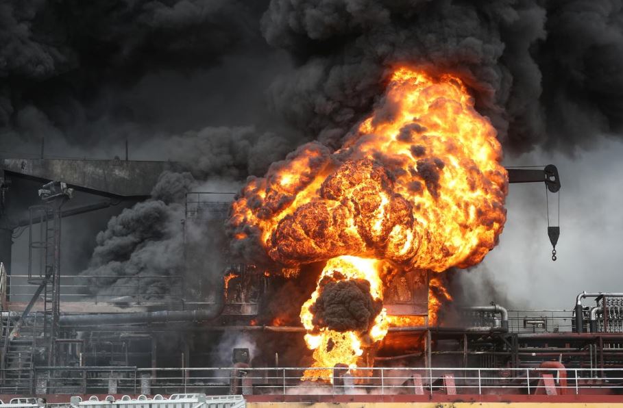 Fire from a vessel is seen at a port in Ulsan, South Korea, September 28, 2019. Yonhap via REUTERS