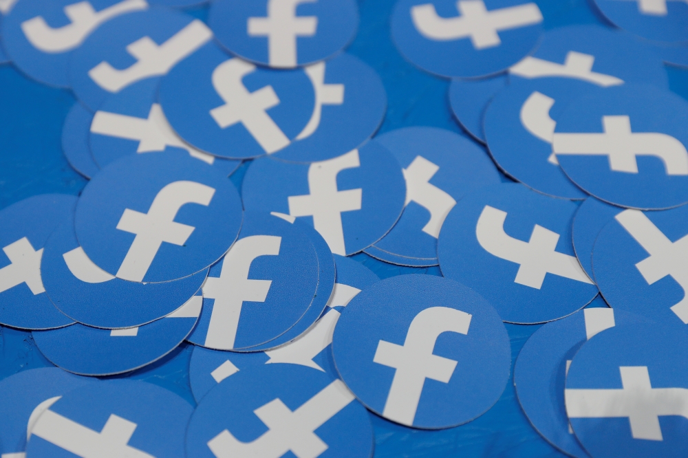 FILE PHOTO: Stickers bearing the Facebook logo are pictured at Facebook Inc's F8 developer's conference in San Jose, California, U.S., April 30, 2019. REUTERS/Stephen Lam