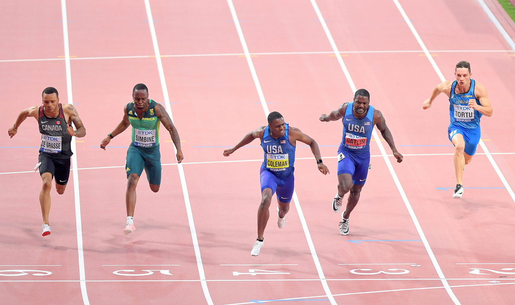 USA’s Christian Coleman (centre) crosses the finish line to win the Men’s 100m final at the 2019 IAAF World Athletics Championships at the Khalifa International stadium in Doha, yesterday. PictureS: Abdul Basit / the Peninsula
