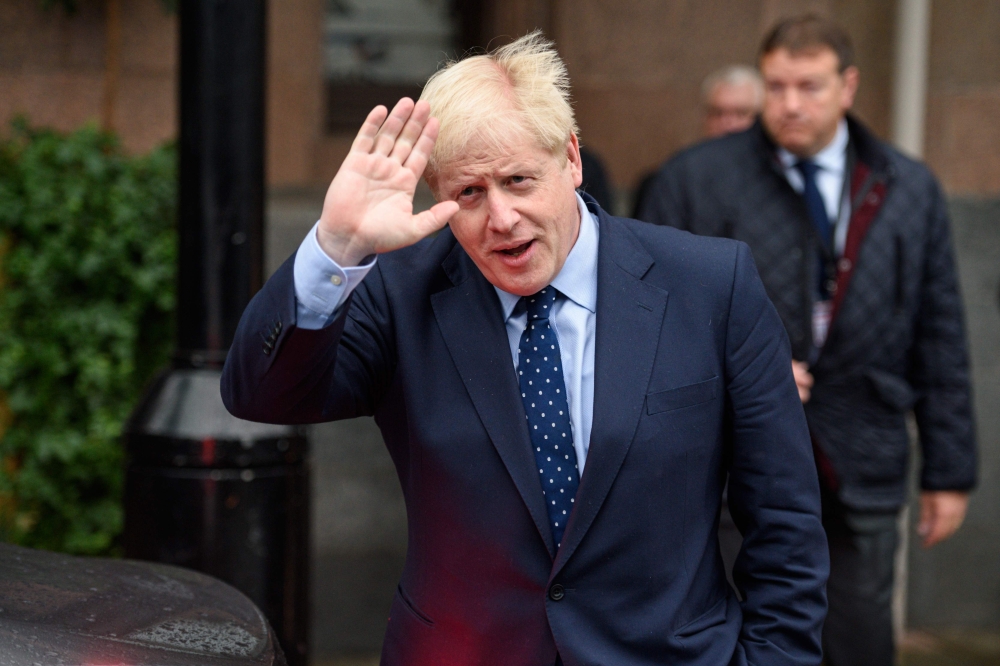 Britain's Prime Minister Boris Johnson leaves The Midland hotel, near the Manchester Central convention complex in Manchester, northwest England on September 29, 2019, on the first day of the annual Conservative Party conference. AFP / OLI SCARFF