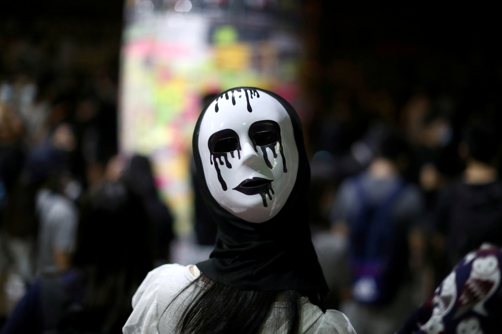 An anti-government protester wears a mask during a demonstration in Wong Tai Sin district, in Hong Kong, China October 4, 2019. Reuters/Athit Perawongmetha