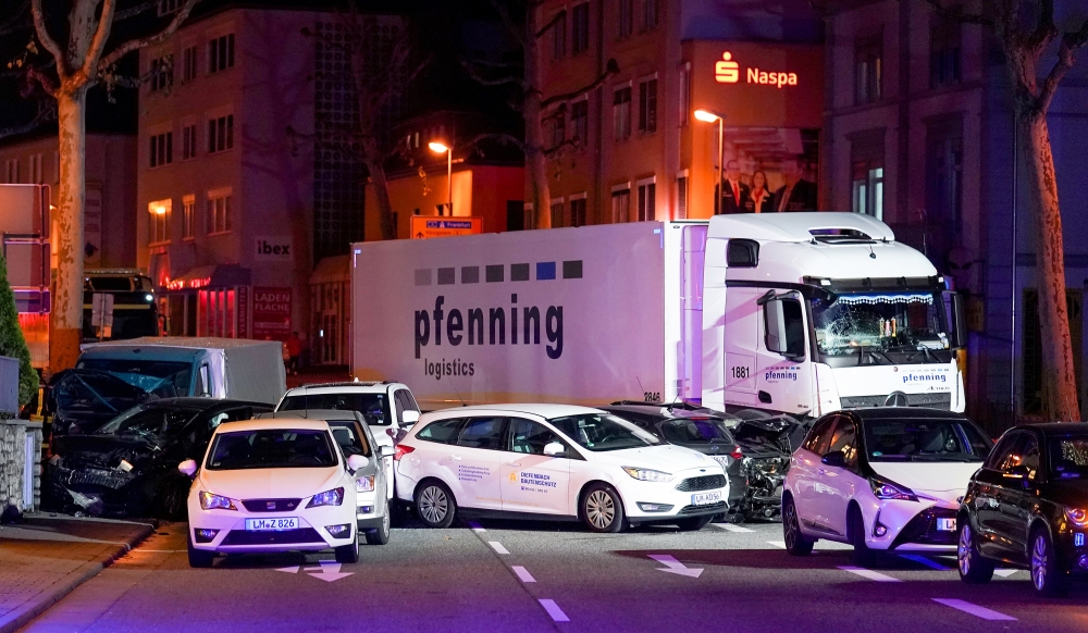A truck stands beside damaged cars in Limburg, Germany, October 7, 2019, after several people were injured when a stolen truck drove into vehicles during rush hour. Picture taken October 7, 2019. Reuters/Stringer