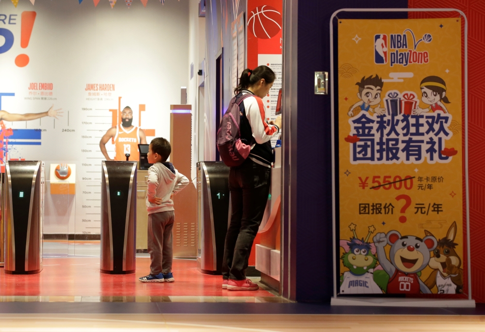A boy waits to enter the NBA Playzone, an NBA-themed indoor playground, at a shopping mall in Beijing, China October 9, 2019. REUTERS/Jason Lee