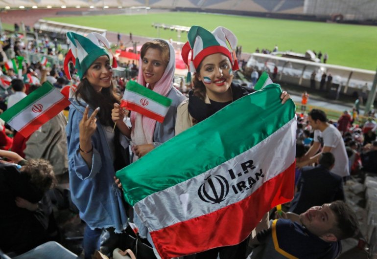 FILE PHOTO: Iranian women watch the World Cup Group B soccer match between Portugal and Iran at Azadi stadium in Tehran. AFP / ATTA KENARE
