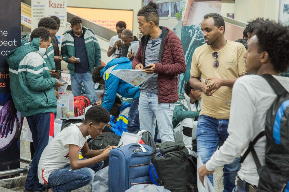 Rwanda's Ministry of Emergency Management (MINEMA) teken on October 10, 2019, shows the arrival of 123 Africal refugees and asylum seekers, mostly Eritreans, from Libya supported by Rwanda's UNHCR, the UN refugee agency, at the Kigali international airpor