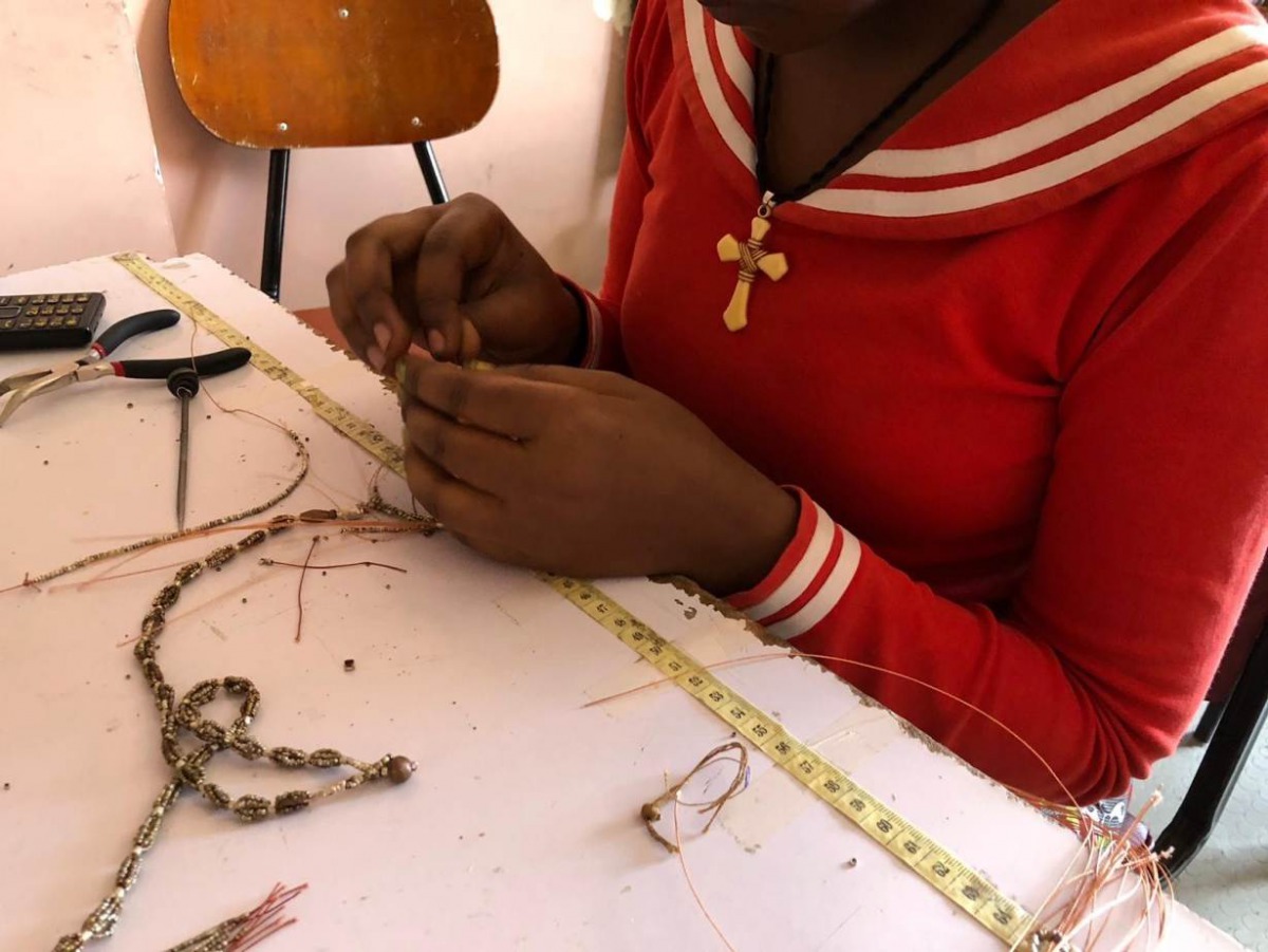A woman rescued from prostitution makes jewellery from bullet casings at Ethiopian social enterprise Ellilta Products in Addis Ababa,October 22, 2019. Thomson Reuters Foundation/Belinda Goldsmith