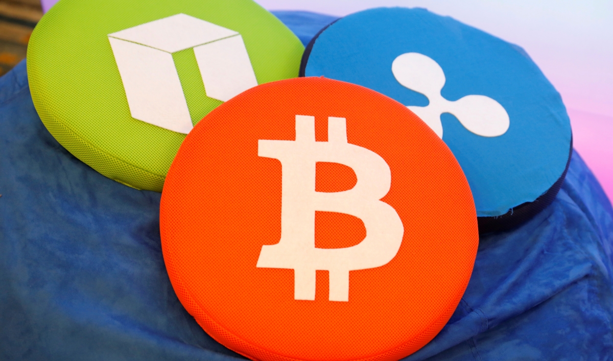 The Bitcoin logo is seen on a pillow on display at the 'Consensus 2018' blockchain technology conference in New York City, May 16, 2018. Reuters / Mike Segar