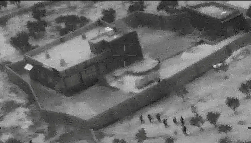 U.S. special forces move towards the compound of Islamic State leader Abu Bakr al-Baghdadi during a raid in the Idlib region of Syria in a still image from video October 26, 2019. Video picture taken October 26, 2019. U.S. Department of Defense/Handout vi