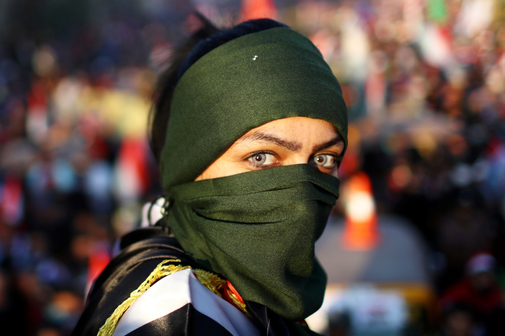 An Iraqi female demonstrator takes part in ongoing anti-government protests in Baghdad, Iraq November 1, 2019. Reuters/Ahmed Jadallah
 