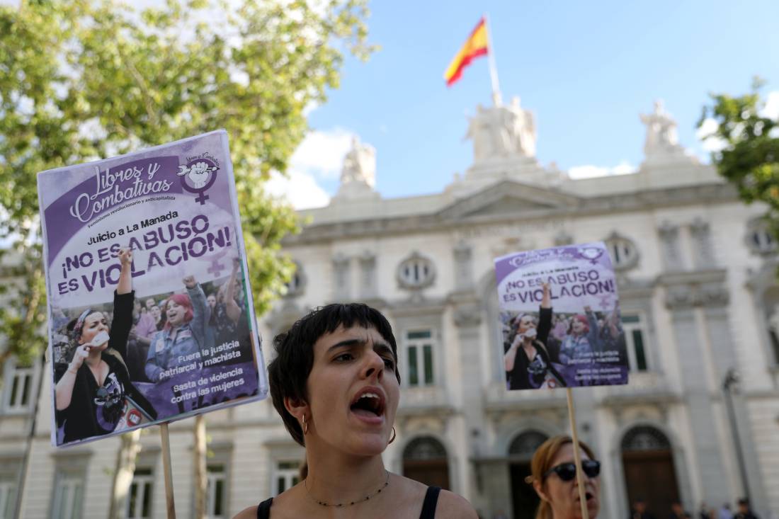 Women gather outside the Supreme Court after Spain's top court found five men known as the 