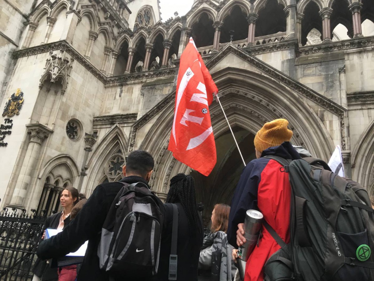 Extinction Rebellion climate change activists gather outside the Royal Courts of Justice in London, October 24, 2019. Thomson Reuters Foundation / Laurie Goering