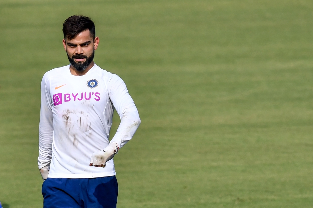 India's captain Virat Kohli walks jokingly during a training session ahead of the first test match between India and Bangladesh at Holkar Cricket Stadium in Indore on November 12, 2019. Gettyout/ AFP / Indranil MUKHERJEE /