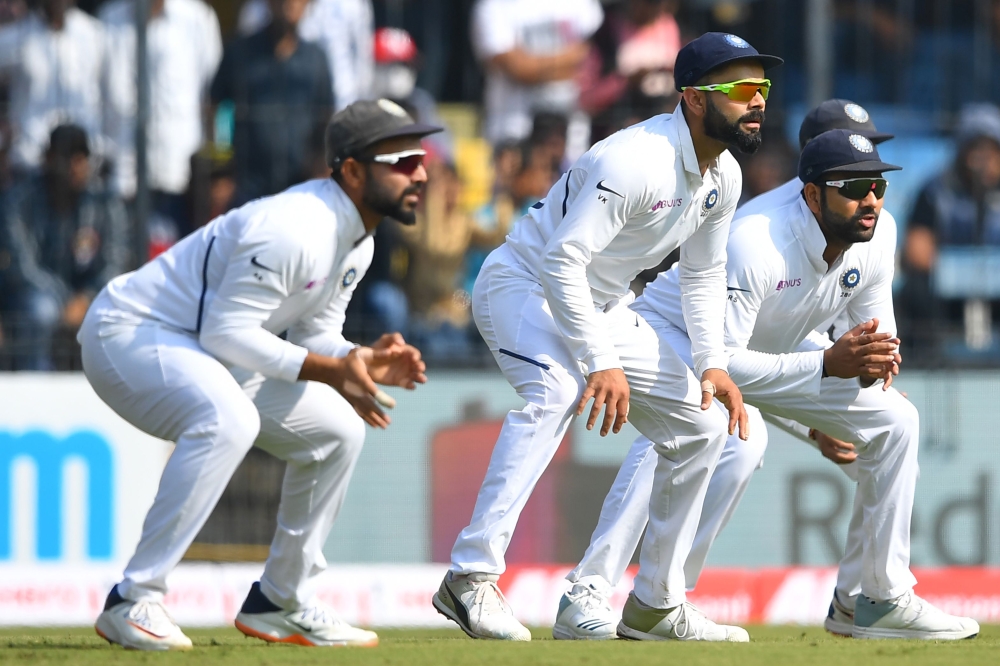 India's (L-R) Ajinkya Rahane, Virat Kohli and Rohit Sharma field in the slip cordon on the first day of the first Test cricket match between India and Bangladesh at the Holkar Cricket Stadium in Indore on November 14, 2019. Gettyout / AFP / Indranil Mukhe