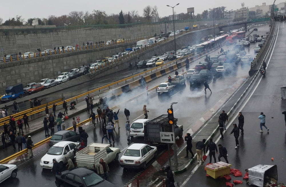 People protest against increased gas price, on a highway in Tehran, Iran November 16, 2019. Nazanin Tabatabaee/WANA (West Asia News Agency) via REUTERS