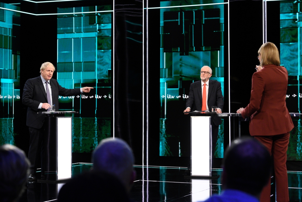 Conservative leader Boris Johnson and Labour leader Jeremy Corbyn are seen during a televised debate ahead of general election in London, Britain, November 19, 2019. Jonathan Hordle/ITV/Handout via REUTERS 