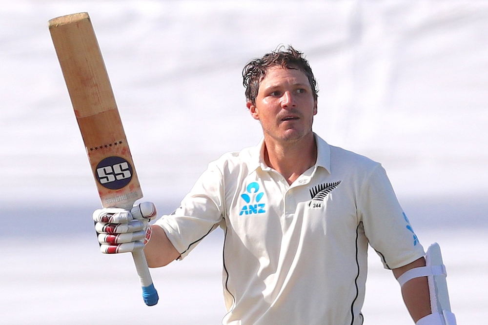 New Zealand's BJ Watling celebrates reaching his century during the third day of the first Test cricket match between England and New Zealand at Bay Oval in Mount Maunganui on November 23, 2019. / AFP / DAVID GRAY