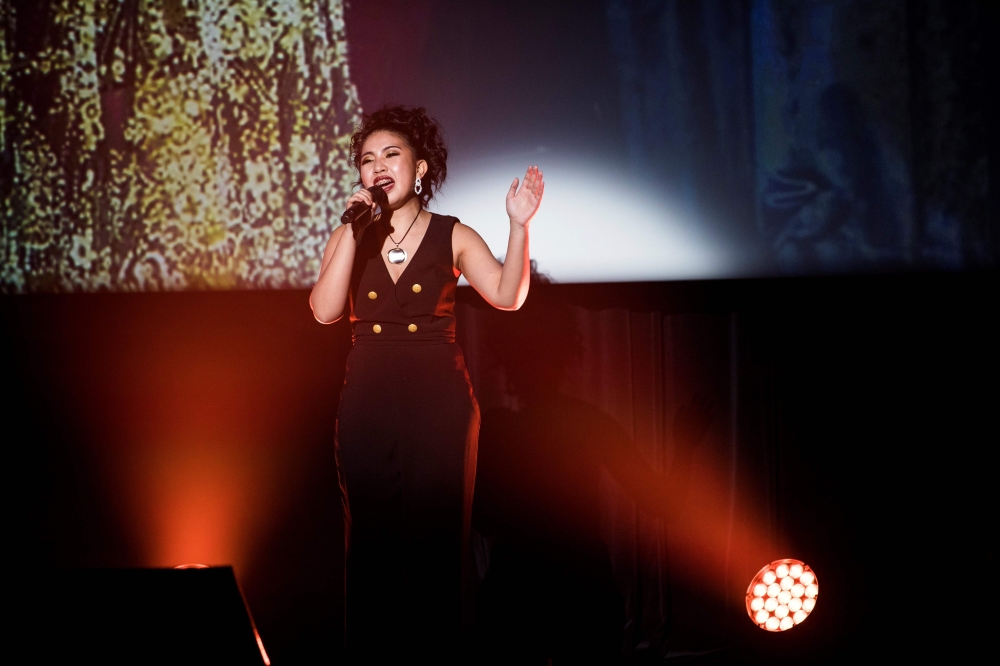In this picture taken on November 28, 2019, Meagen Reyes of the Philippines sings during the Karaoke World Championships in Tokyo. AFP / Behrouz Mehri