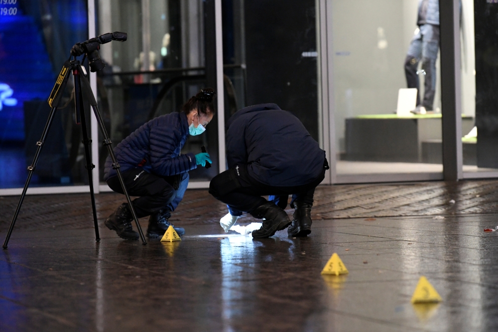 Forensics officers work near the site of a stabbing on a shopping street in The Hague, Netherlands November 29, 2019. REUTERS/Piroschka van de Wouw