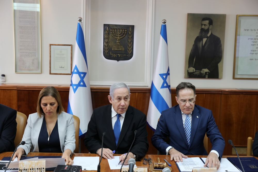 Israeli Prime Minister Benjamin Netanyahu, Minister for Social Equality Gila Gamliel (L) and Cabinet Secretary Tzachi Braverman (R) attend the weekly cabinet meeting at Netanyahu's office in Jerusalem in Jerusalem December 1, 2019. Abir Sultan/Pool via Re