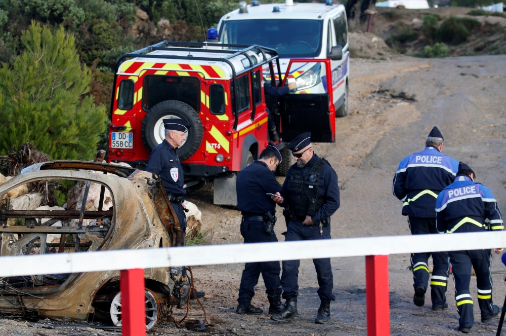 French police secure the area around the site where a helicopter from the civil security services crashed while en route to help people caught up in heavy flooding, in Le Rove near Les-Pennes-Mirabeau, France, December 2, 2019. REUTERS/Jean-Paul Pelissier