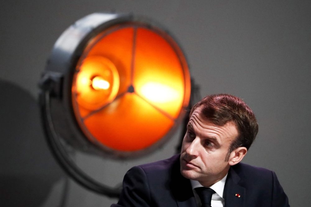 French President Emmanuel Macron attends the annual conference of the French maritime economy in Montpellier, southern France, on December 3, 2019. / AFP / Pool / Guillaume Horcajuelo 