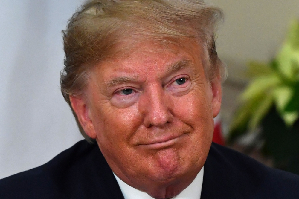 US President Donald Trump speaks during his meeting with French President London on December 3, 2019. / AFP / Nicholas Kamm