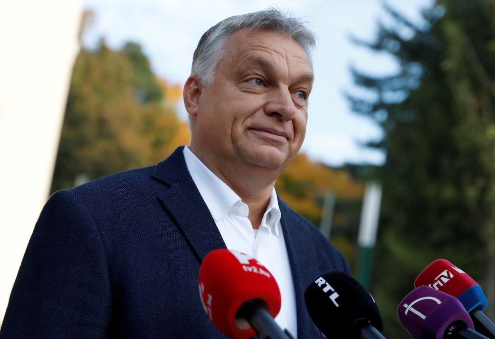 Hungarian Prime Minister Viktor Orban talks to the media after casting his ballot during local elections in Budapest, October 13, 2019. Reuters/Bernadett Szabo