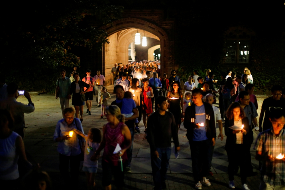 FILE PHOTO: People attend a vigil for Xiyue Wang at Princeton University in Princeton, New Jersey, U.S. September 15, 2017.