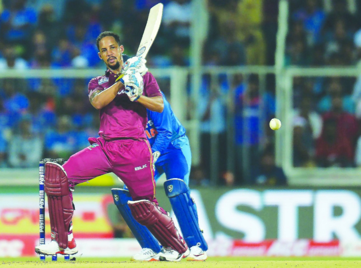 West Indies' Lendl Simmons plays a shot during the second T20 international cricket match of a three-match series between India and West Indies at the Greenfield International Stadium in Thiruvananthapuram on December 8, 2019.  AFP / Arun Sankar

