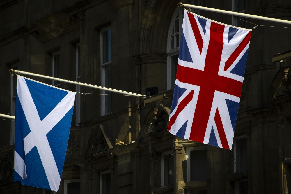 Flags of Scotland and the Union hang from flagpoles in Edinburgh, Scotland on April 11, 2019. AFP / Andy Buchanan