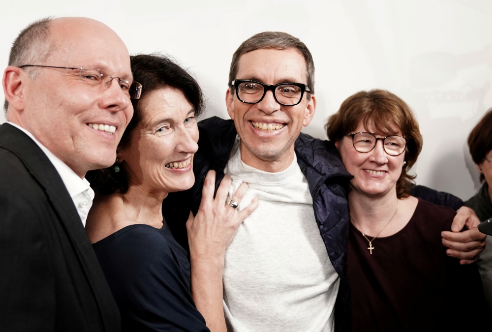 Jens Soering celebrates with supporters after his arrival at Frankfurt airport, Germany, December 17, 2019.  Reuters/Thorsten Wagner
