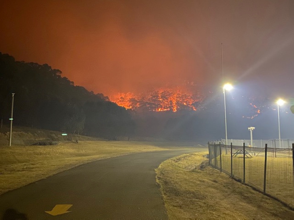 A bushfire burns near the Lithgow Correctional Centre compound in Marrangaroo, New South Wales, Australia December 19, 2019 in this picture obtained from social media. 