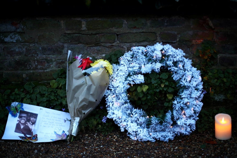 Tributes are seen outside the home of former singer George Michael after his sister, Melanie Panayiotou, 55, was found dead on Christmas Day, in London, Britain December 27, 2019. Reuters/Hannah McKay