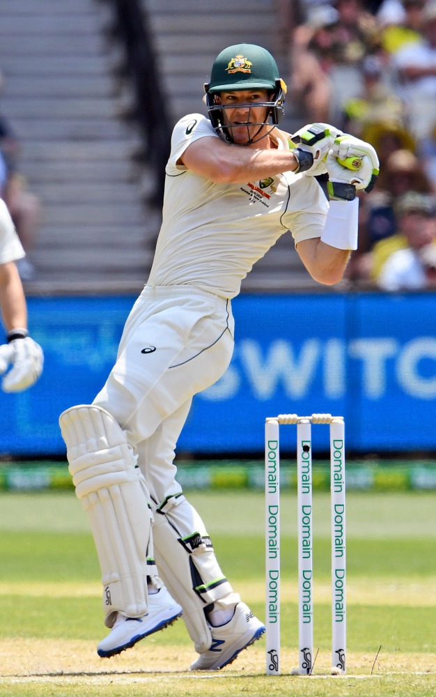Australian batsman Tim Paine pulls a ball away from the New Zealand bowling on the second day of the second cricket Test match at the MCG in Melbourne on December 27, 2019. AFP / William West