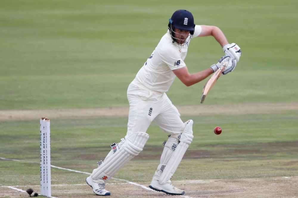 England's Dom Sibley watches the ball after playing a shot during the third day of the first Test cricket match between South Africa and England at The SuperSport Park stadium at Centurion near Pretoria on December 28, 2019. / AFP / MARCO LONGARI 