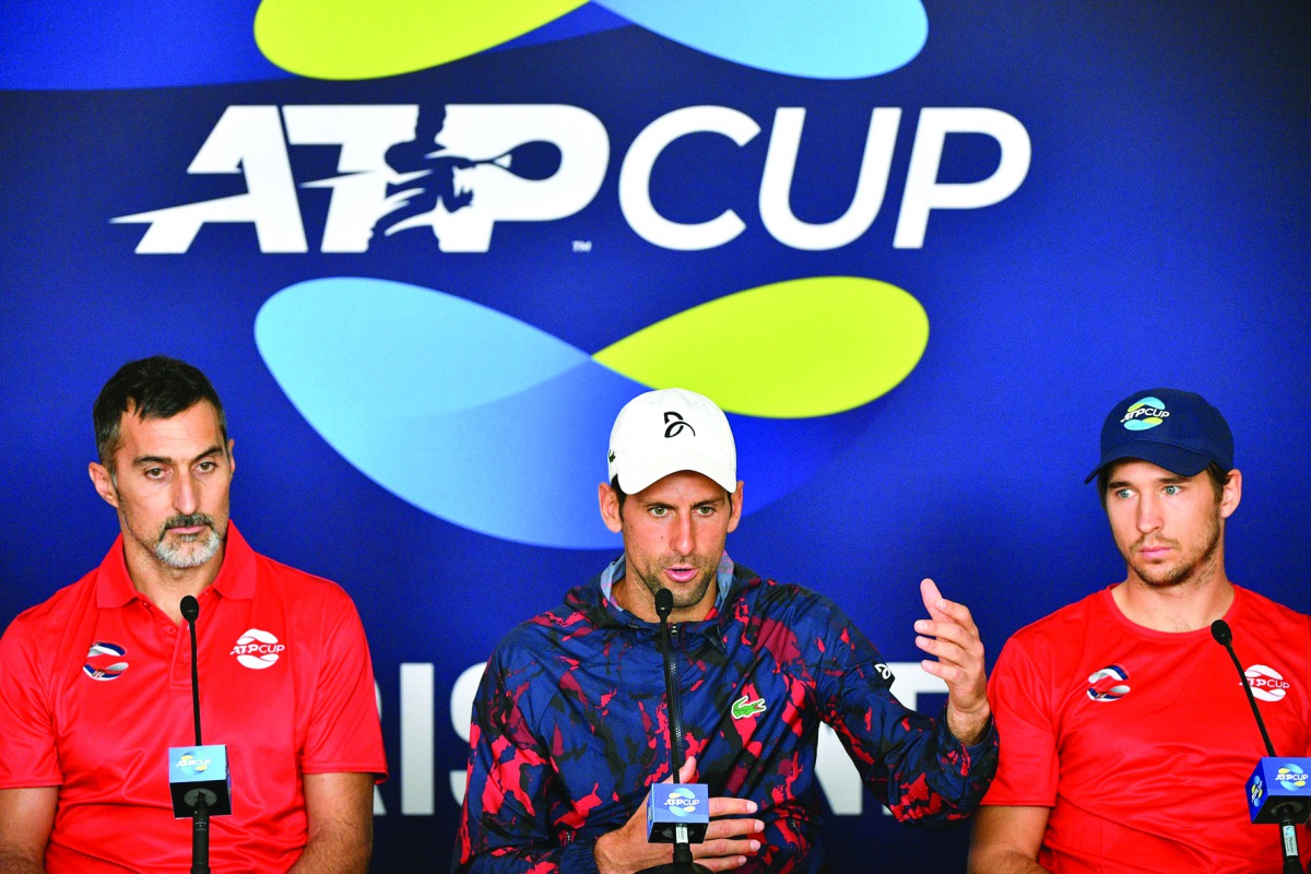 Members of Serbia's team (L to R) Nenad Zimonjic, Novak Djokovic and Dusan Lajovic attend a press conference ahead of the ATP Cup tennis tournament in Brisbane on January 2, 2020.  AFP / Saeed Khan