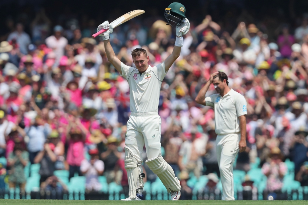 Australia’s Marnus Labuschagne (C) celebrates scoring a double century during the second day of the third cricket Test match between Australia and New Zealand at the Sydney Cricket Ground in Sydney on January 4, 2020./ AFP / JEREMY NG / --