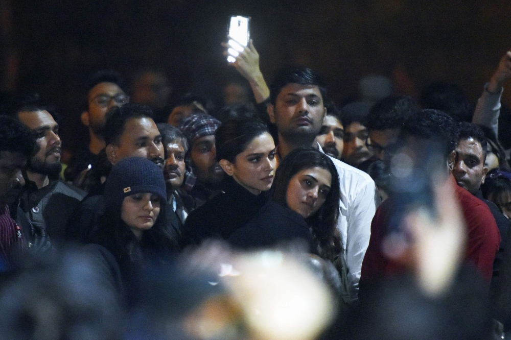 In this photo taken on January 7, 2020, Bollywood actress deepika Padukone (C) visits students protesting at Jawaharlal Nehru University (JNU) against a recent attack at JNU on students and teachers in New Delhi.
Protests have been held across India afte