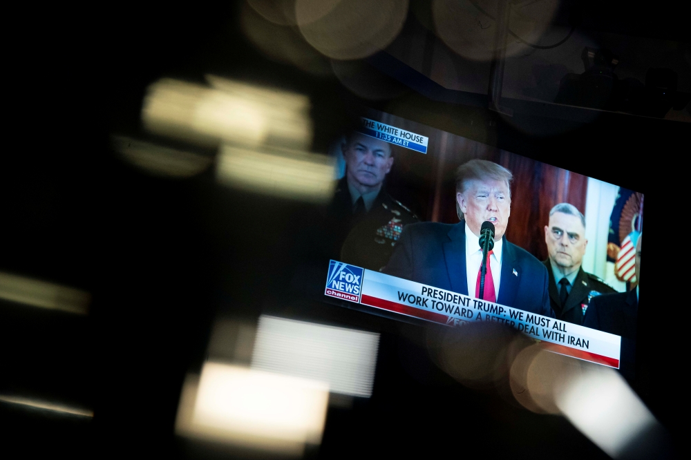 US President Donald Trump is seen on a television screen as he delivers a statement about Iran, in the Pentagon briefing room in Arlington, Virginia, US, January 8, 2020. Reuters/Al Drago