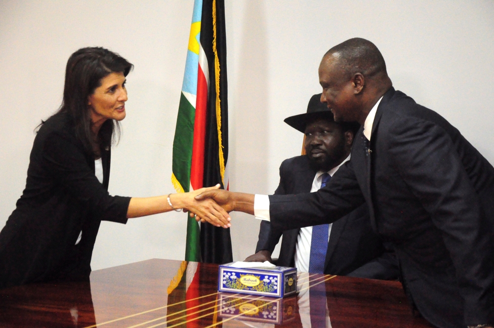 FILE PHOTO: US Ambassador to the United Nations Nikki Haley greets South Sudan's First Vice President Taban Deng Gai next to South Sudan President Salva Kiir, in Juba, South Sudan October 25, 2017. Reuters/Jok Solomun