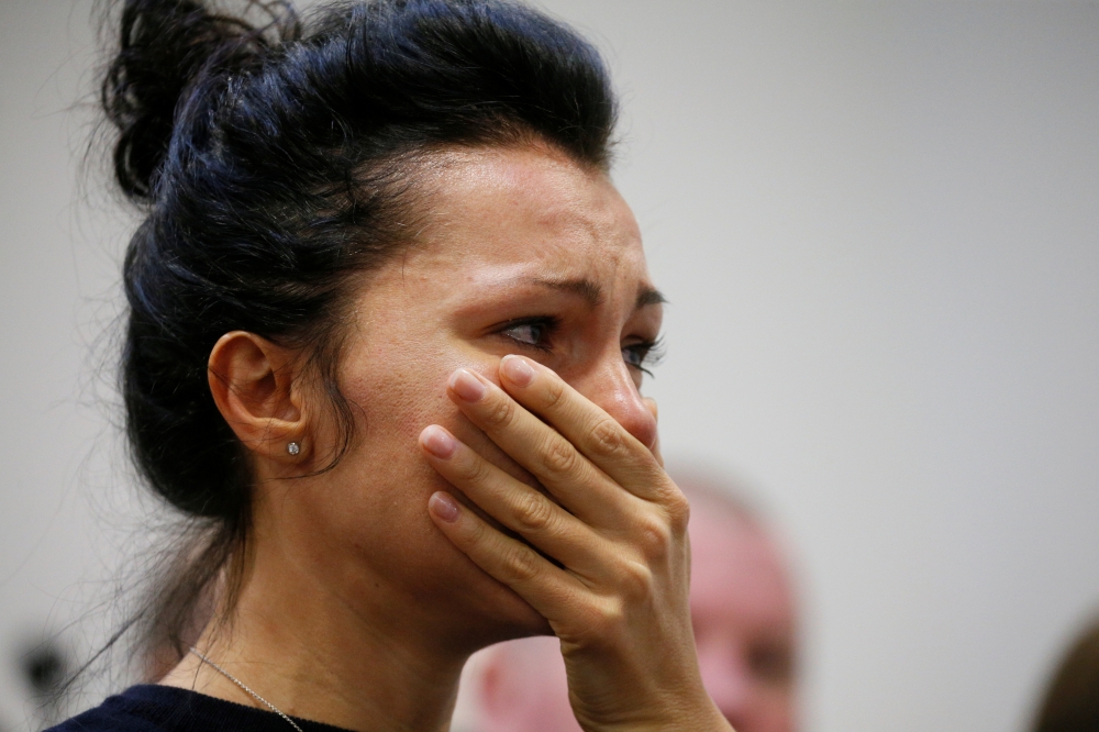 A woman reacts during a news briefing following the crash of the Boeing 737-800 plane, flight PS 752, on the outskirts of Tehran, at the Boryspil International Airport, outside Kiev, Ukraine January 8, 2020. REUTERS/Valentyn Ogirenko