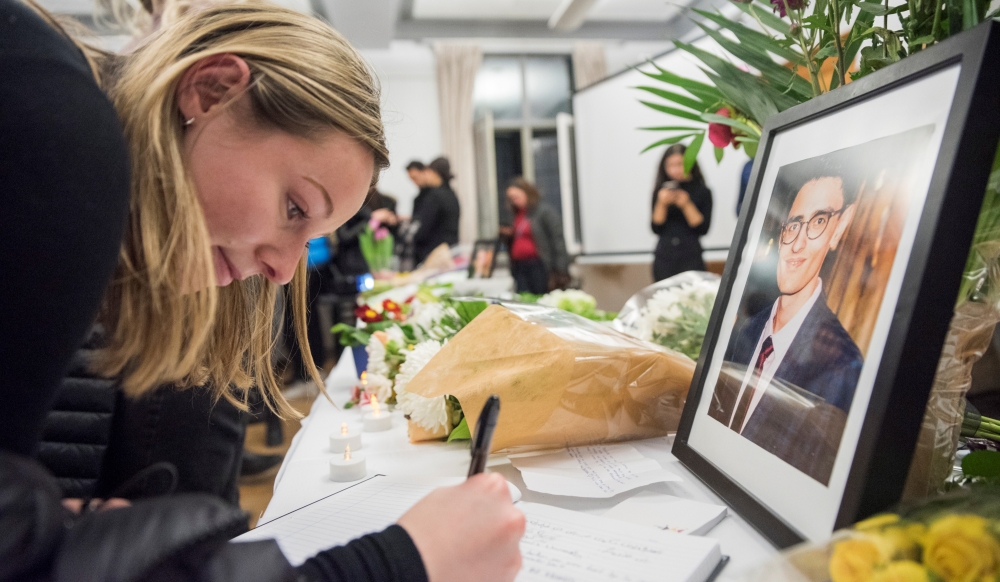 Mourners attend a vigil in memory of Iranian student Amir Moradi, who was killed in the crash of a Ukrainian passenger plane near Tehran, at Queens University in Kingston, Ontario, Canada January 10, 2020. REUTERS/Alex Filipe.