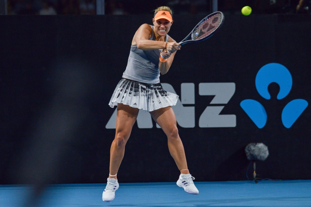 Angelique Kerber of Germany hits a return against Wang Qiang of China during their women's first round singles match at the Adelaide International tennis tournament in Adelaide on January 13, 2020. (AFP / Brenton EDWARDS )