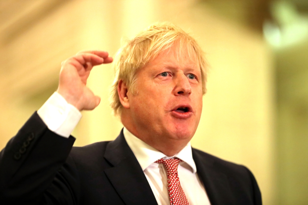 Britain's Prime Minister Boris Johnson speaks in the Stormont Parliament Buildings in Belfast, Northern Ireland, January 13, 2020. Liam McBurney/Pool via Reuters 