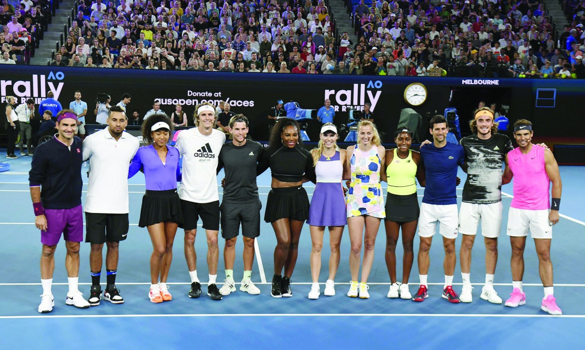 The world's top tennis players pose for a photo in the Rally for Relief charity tennis match in support of the victims of the Australian bushfires, in Melbourne of January 15, 2020, ahead of the Australian Open tennis tournament. AFP / William West