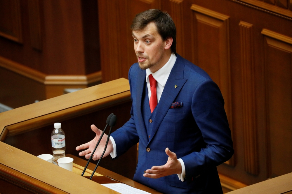 Oleksiy Honcharuk, Ukrainian politician nominated to become new Prime Minister, addresses lawmakers during the first session of the newly elected parliament in Kiev, Ukraine August 29, 2019. REUTERS/Gleb Garanich/File Photo