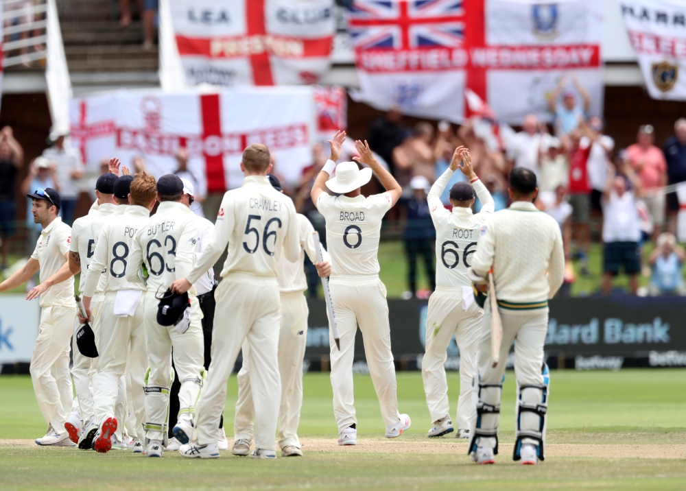 Cricket - South Africa v England - Third Test - St George's Park, Port Elizabeth, South Africa - January 20, 2020 England's Stuart Broad, Joe Root and teammates applauds fans after the match REUTERS/Siphiwe Sibeko
