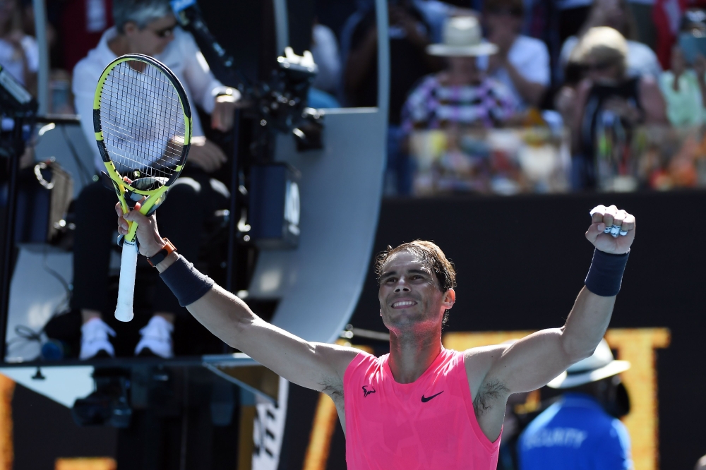 Spain's Rafael Nadal celebrates victory against Bolivia's Hugo Dellien during their men's singles match on day two of the Australian Open tennis tournament in Melbourne on January 21, 2020.  AFP / John DONEGAN / 

