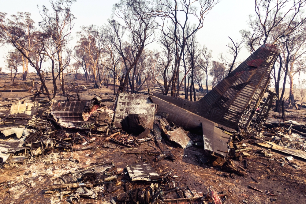 Debris seen following the crash of a C-130 air tanker plane after dropping fire retardant, in this January 24, 2020 picture obtained from social media, in Snowy Mountains, New South Wales, Australia. New South Wales Police via Reuters
