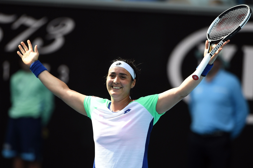 Tunisia's Ons Jabeur celebrates after a victory against China's Wang Qiang during their women's singles match on day seven of the Australian Open tennis tournament in Melbourne on January 26, 2020. /AFP / Greg Wood /